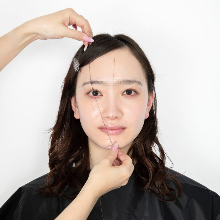 Thread guide lines mapped across a face during a Fortunebrows brow diagnosis